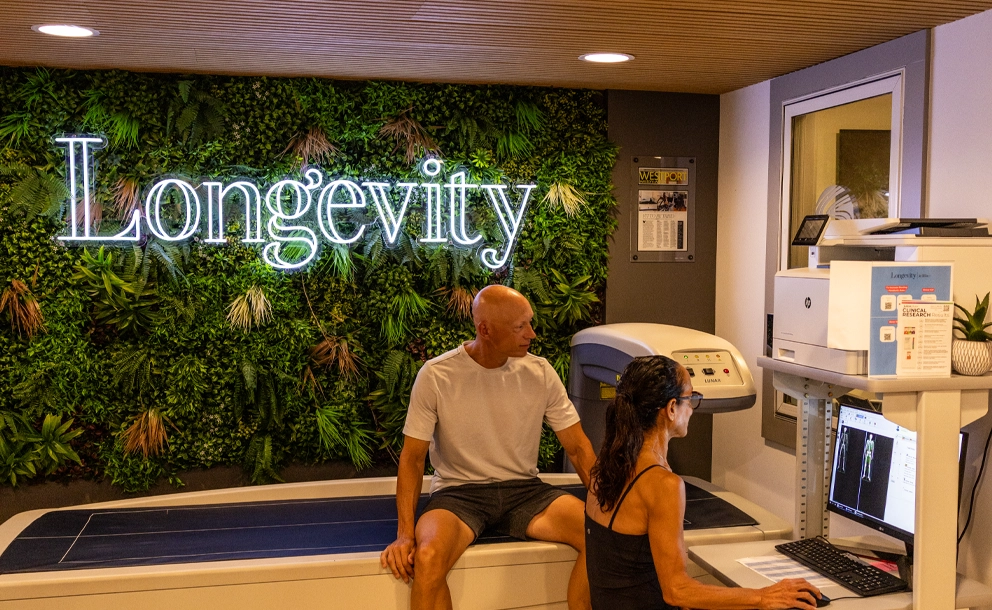 Longevity Westport staff member consulting with client about DEXA scan body composition results at Sherpa fitness studio in Westport CT