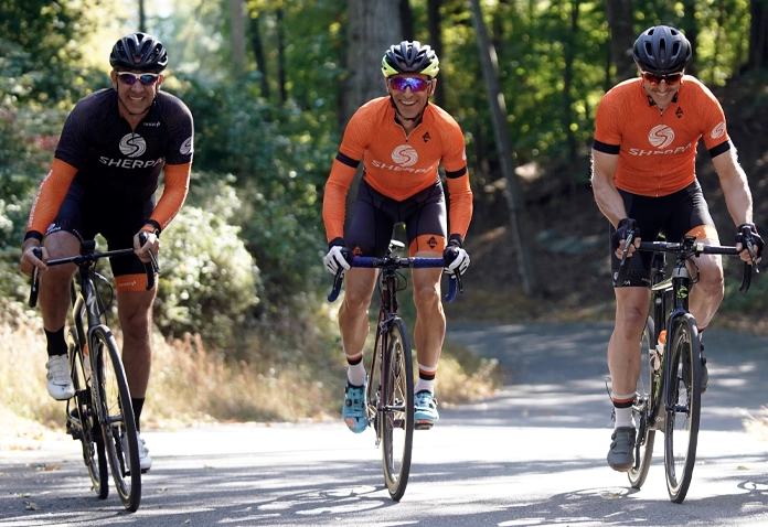Three cyclists in Sherpa kit training for endurance in Westport CT with Sherpa coaching.