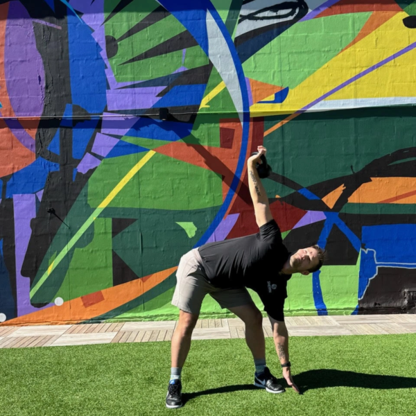 Luke Yoder performing a kettlebell swing to build explosive hip power and strength for golfers training in Westport, CT.