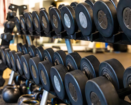 Rack of dumbbells at Sherpa Fit representing strength training as the foundation while using GLP-1 medications.