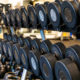 Rack of dumbbells at Sherpa Fit representing strength training as the foundation while using GLP-1 medications.