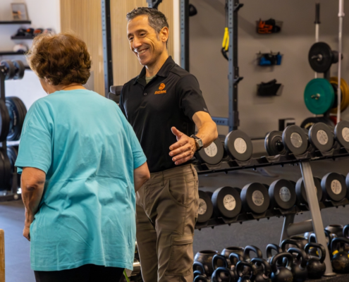 Thor coaching an older client during personal training in Westport CT