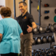 Torr coaching an older client during personal training in Westport CT