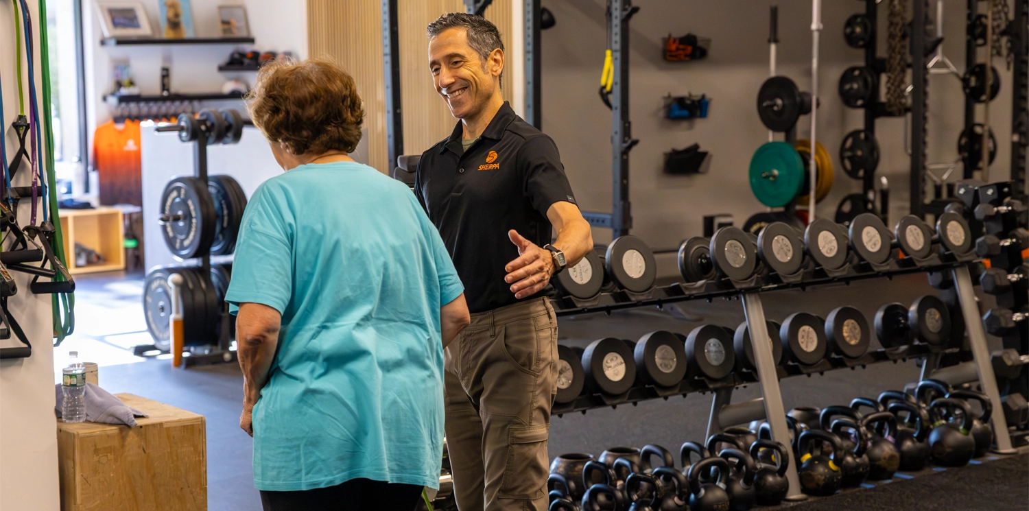Thor coaching an older client during personal training in Westport CT