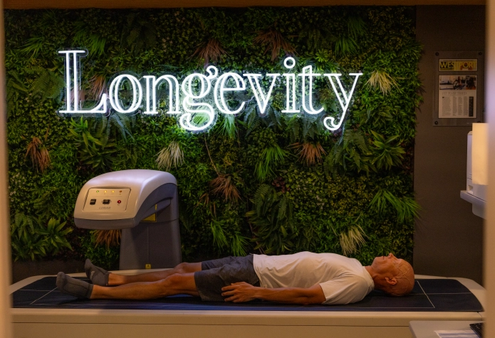 Cycling Performance Training | Sherpa Beyond the Gym Man receiving a DEXA body composition scan at Longevity Westport in Westport, CT